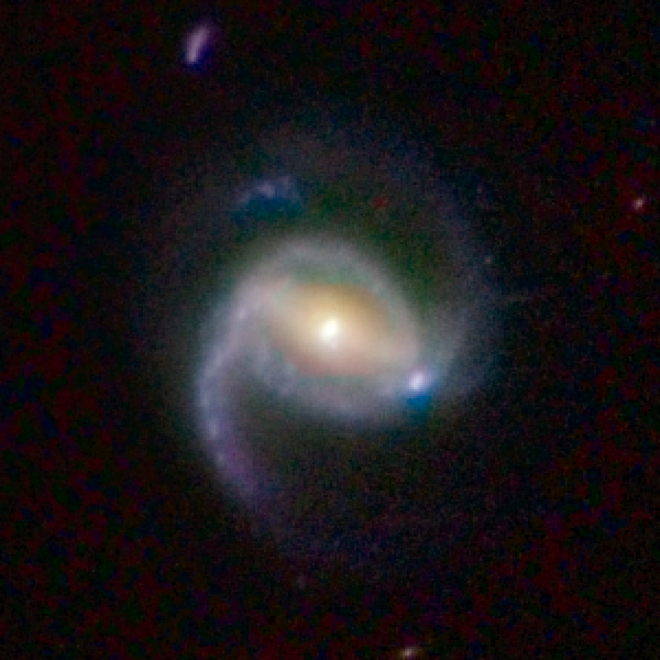 La galaxie spirale barrée COSMOS 3127341 à 2,1 milliards d'années-lumière. Crédit : Nasa, Esa, K. Sheth (Spitzer Science Center, California Institute of Technology), P. Capak et N. Scoville (California Institute of Technology)