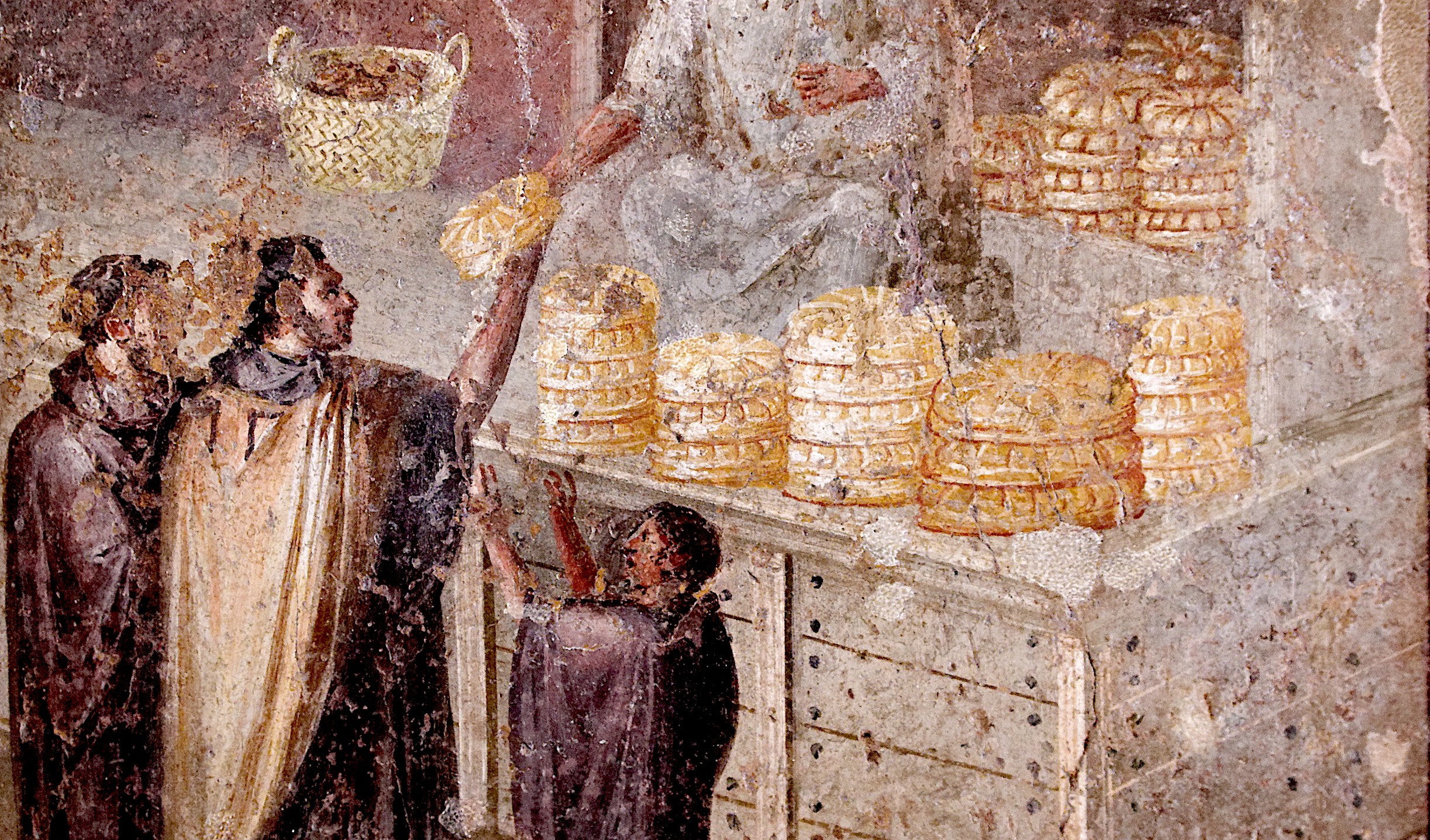 Cette fresque représente une distribution ou la vente de pain dans une boulangerie à Pompéi sous la Rome antique. © Musée archéologique national de Naples, Domaine public, Wikimedia Commons