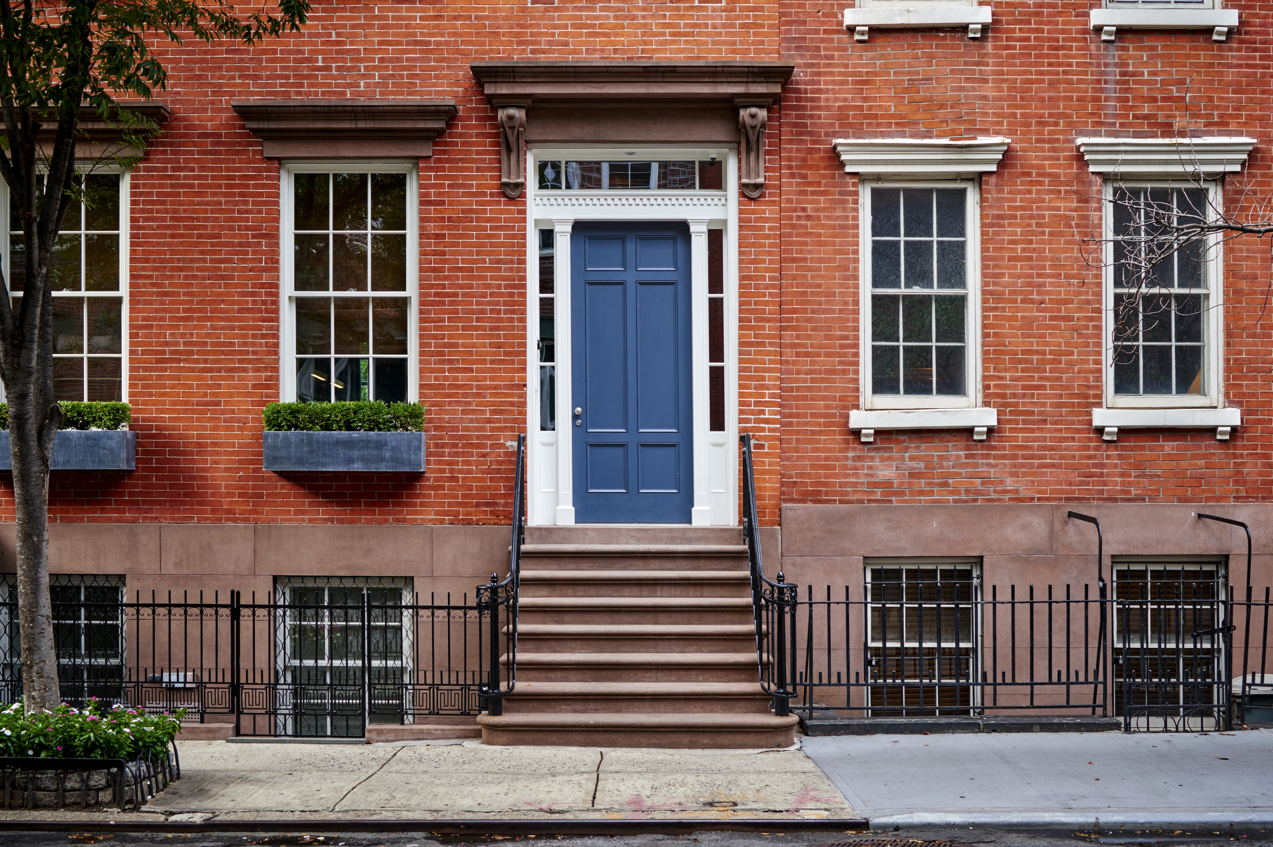 La transaction immobilière de cette résidence luxueuse avec sa façade de briques se fera-t-elle en cryptomonnaie d'ici cinq ans ? © goodmanphoto, Adobe Stock