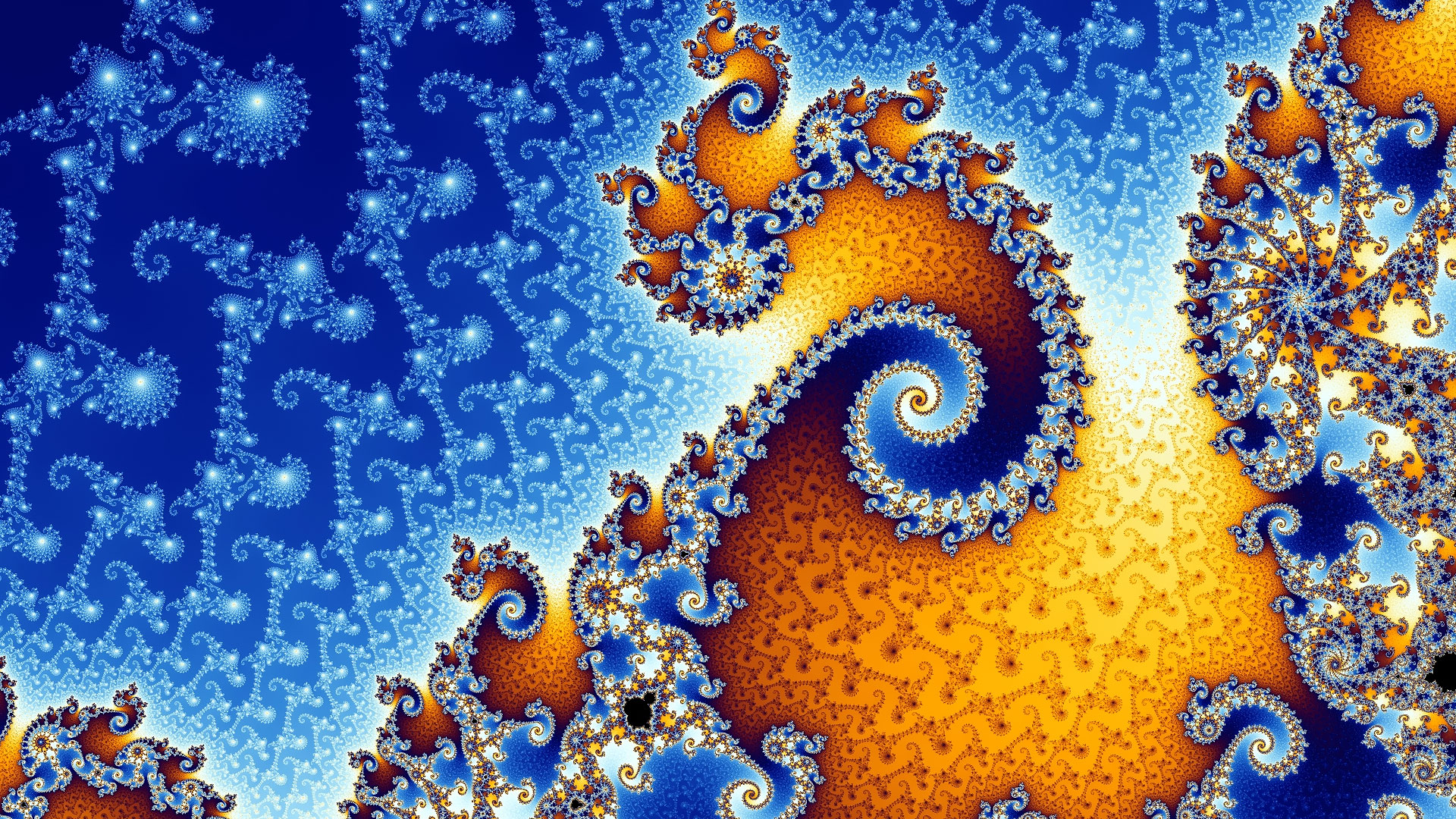 Les somptueuses spirales de Mandelbrot. L’ensemble de Mandelbrot est une collection de points contenant des aires, des courbes lisses, des filaments, etc. Cette fractale forme des figures d’une beauté fascinante. L’image en montre un détail : les tons bleus et orange dominent et forment des spirales ressemblant à une coquille d’escargot. © Futura-Sciences
