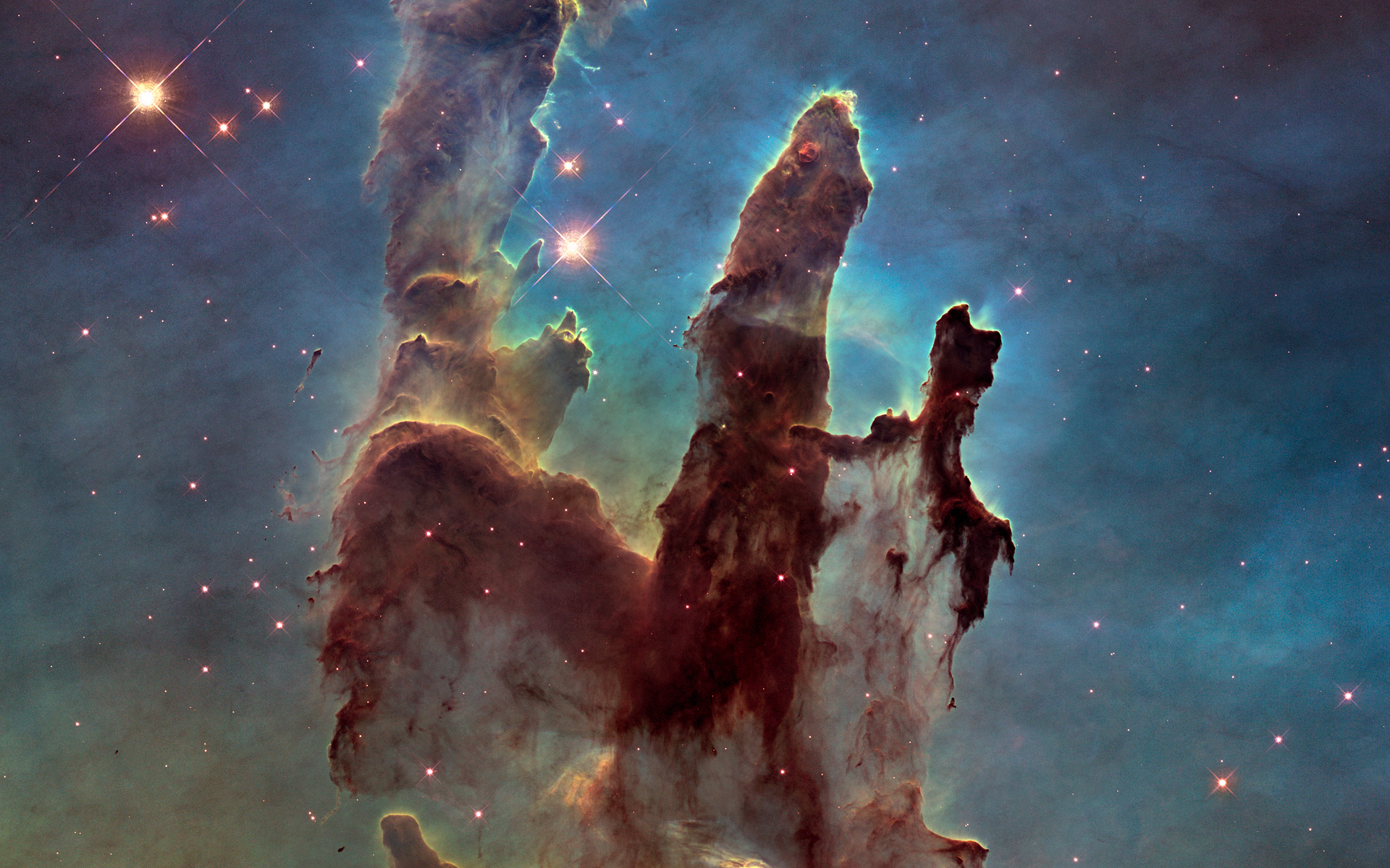 Piliers de gaz et de poussières au centre de la nébuleuse de l’Aigle, un nuage de formation d’étoiles typique de la Voie lactée. © Nasa, ESA, Hubble