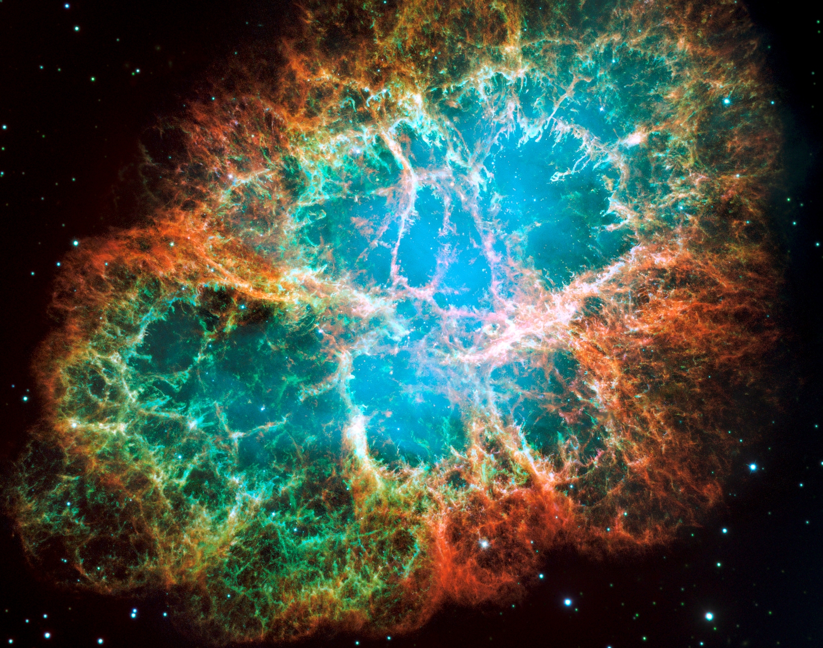 La nébuleuse du crabe, un nuage de débris en expansion de six années-lumière de diamètre provenant d'une explosion de supernova, héberge une étoile à neutrons tournant sur elle-même 30 fois par seconde  et qui fait partie des pulsars les plus brillants du ciel aux longueurs d'onde des rayons X et radio. Cette composition d'images du télescope spatial Hubble révèle différents gaz expulsés lors de l'explosion: le bleu révèle l'oxygène neutre, le vert montre le soufre mono-ionisé et le rouge indique l'oxygène doublement ionisé. © Nasa, ESA, J. Hester et A. Loll (Arizona State University)