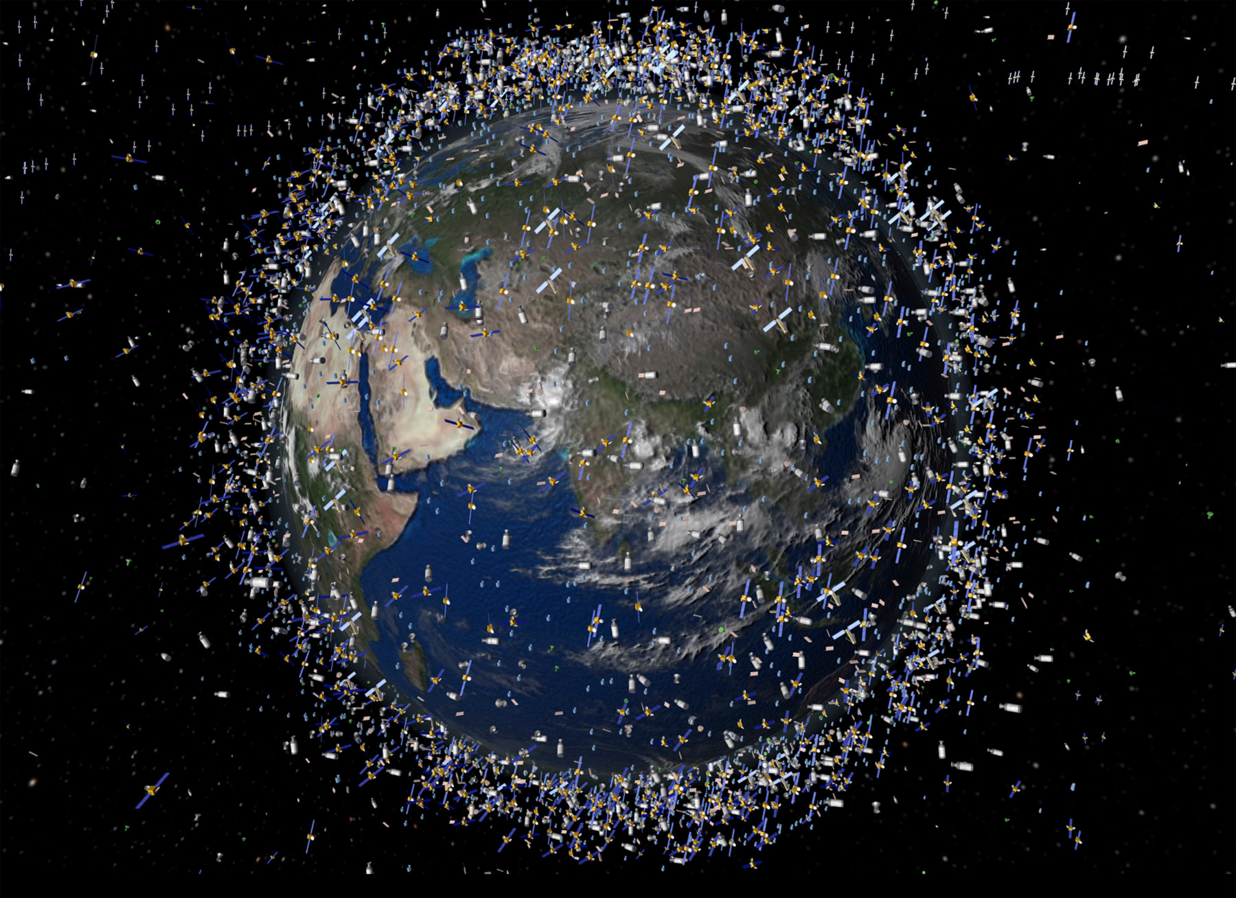 Vision d'artiste des débris spatiaux présents autour de la Terre, en orbite basse jusqu'à environ 2.000 km d'altitude. Une telle densité de satellites nécessite aujourd'hui une sorte de « code de la route » pour réguler et organiser le trafic spatial. © ESA