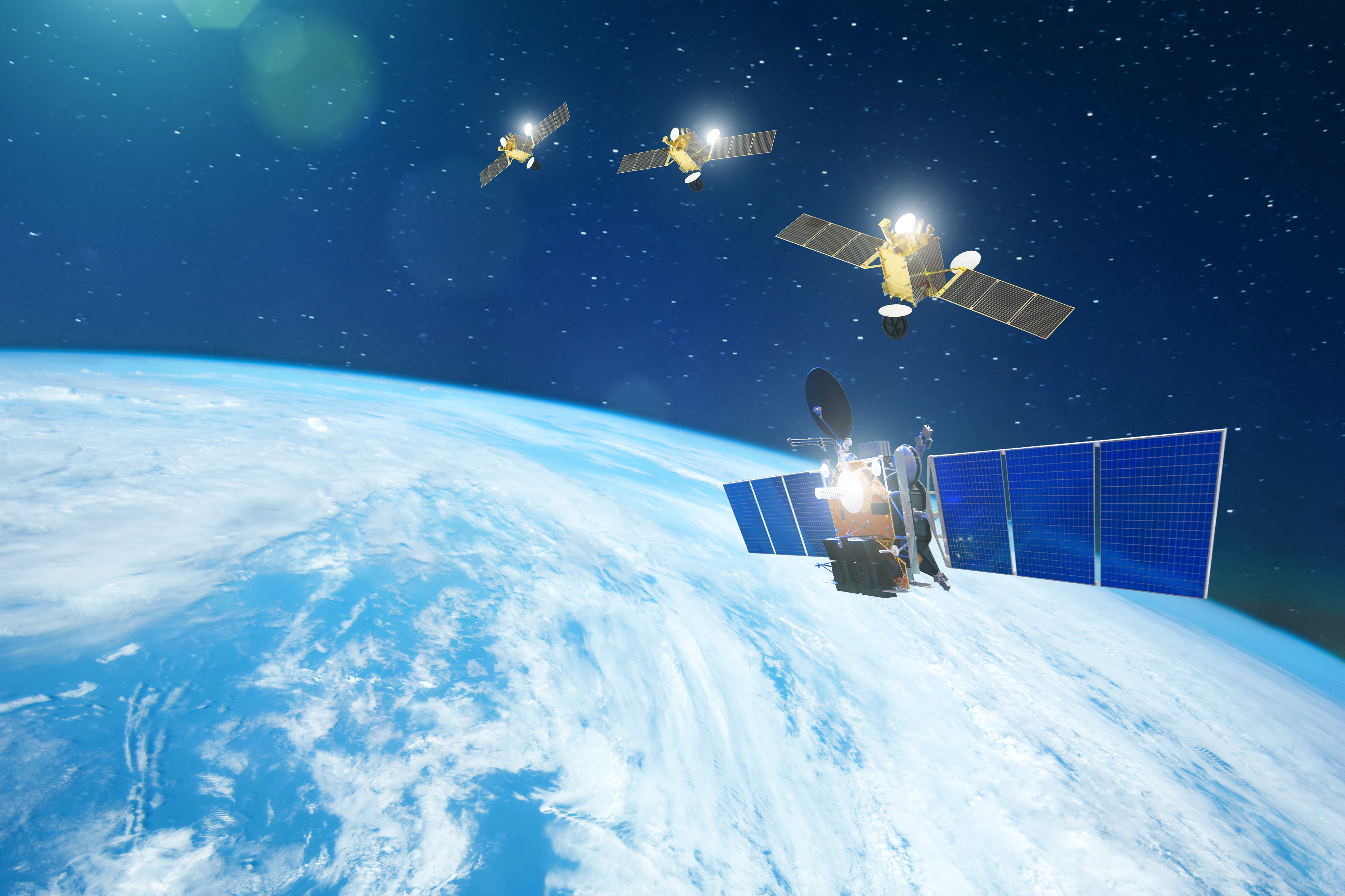 Groupe de satellites en orbite autour de la Terre. (Éléments de cette image fournis par la Nasa.) © Aapsky, Adobe Stock